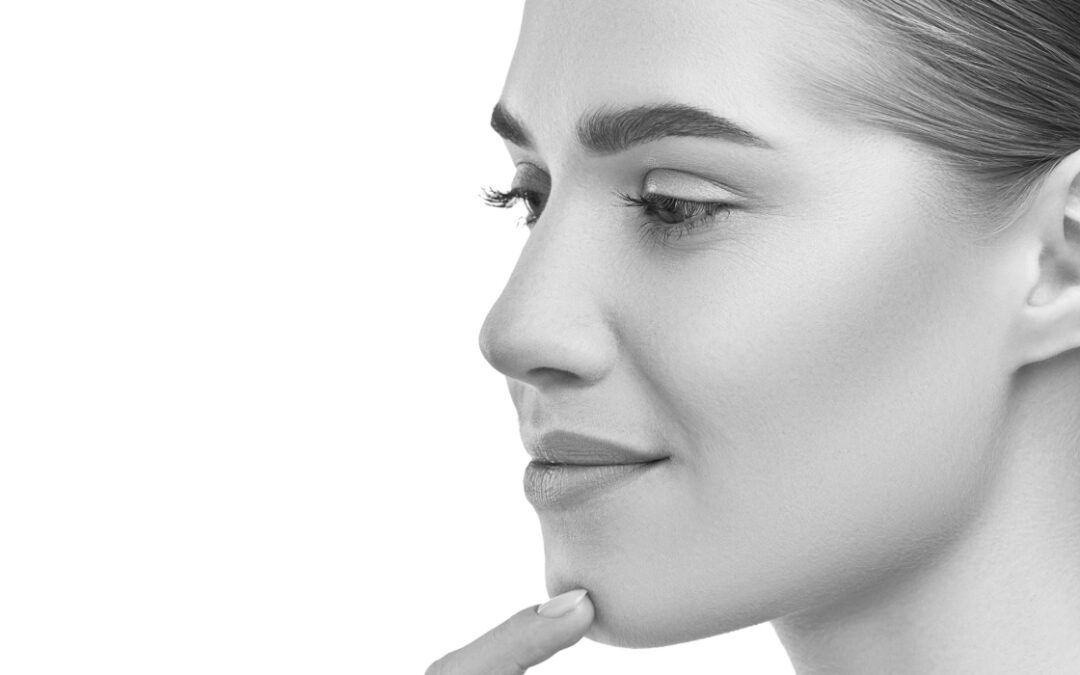 Beautiful womans profile left side close-up studio on white. | Nose Fillers for wide noses